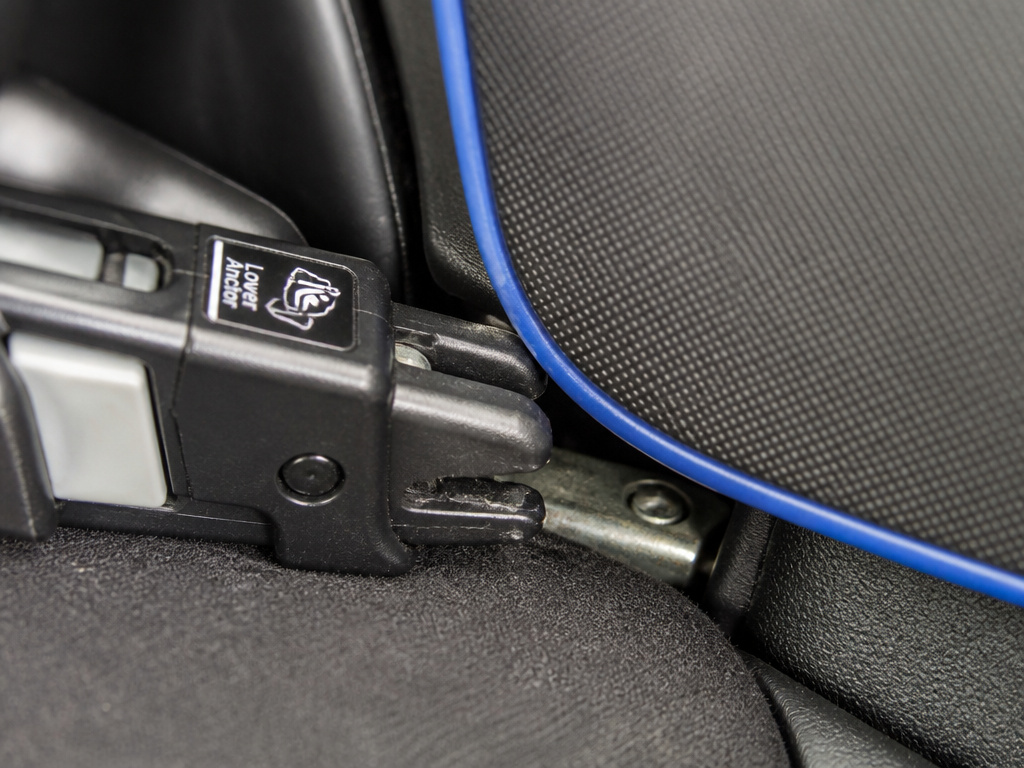 Car seat lower anchor connector interference from a blue seat protector mat
